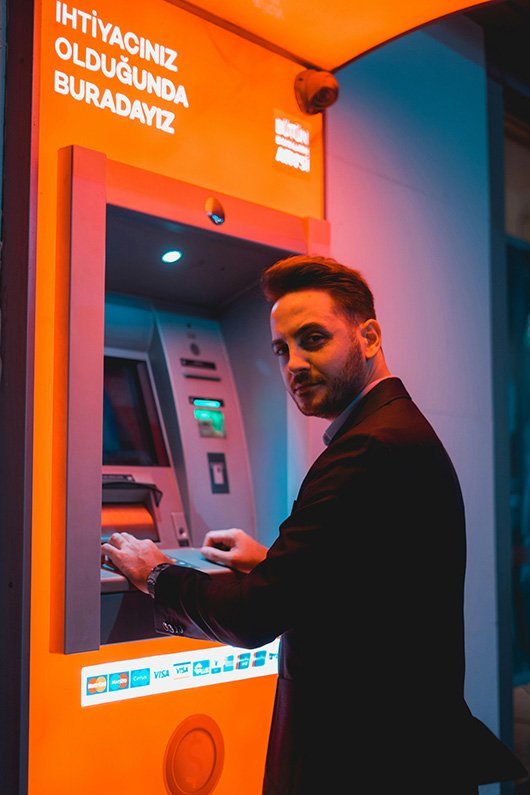 a man using an atm machine