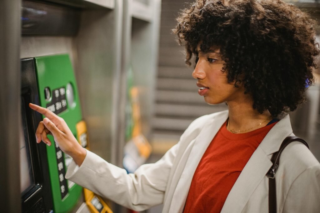 Person collecting cash from an ATM